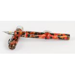 A Conklin "Mark Twain" fountain pen with mottled orange, red and black body, nib inscribed "Conklin,