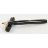 A Conway Stewart "The Conway Stewart" fountain pen with dark brown/black body and 14ct yellow gold