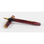 A Conway Stewart 36 fountain pen with maroon vertical striped body and 14ct yellow gold nib,