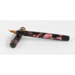 A "The Burnham" fountain pen with pink and black marbled pearl body, and 14ct gold nib, length 13.