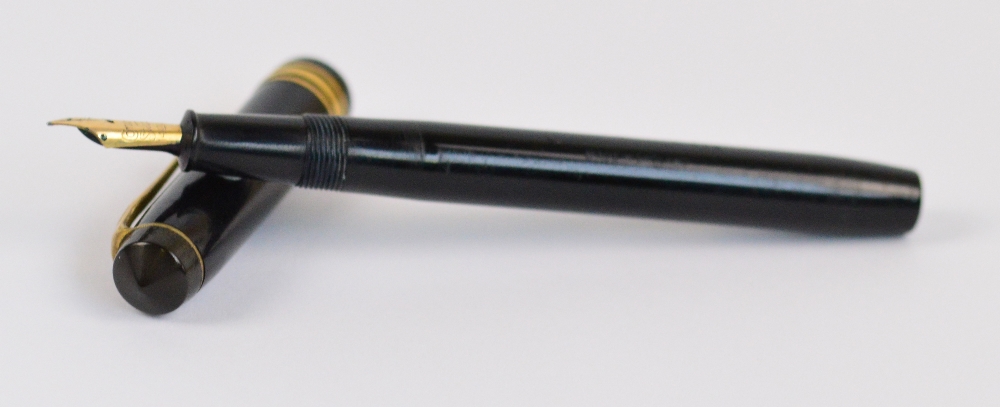 A Conway Stewart 388 fountain pen with black body and 14ct gold nib, length 12.5cm.