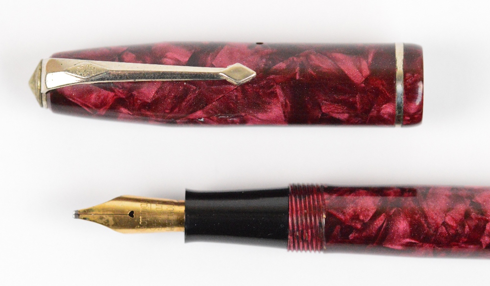 A Conway Stewart 75 fountain pen with rose pearl marbled body and 14ct yellow gold nib, length 12. - Image 3 of 3