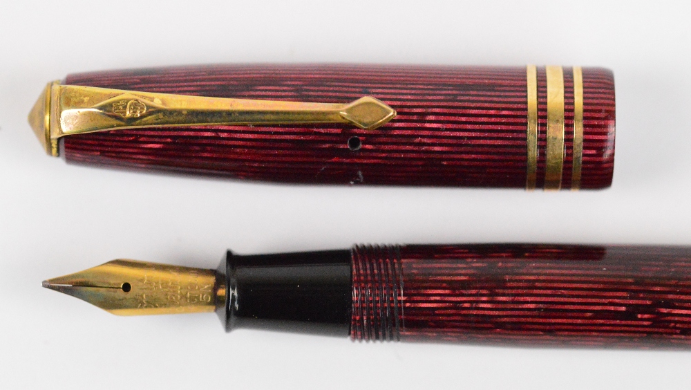 A Conway Stewart 36 fountain pen with maroon vertical striped body and 14ct yellow gold nib, - Image 3 of 3