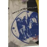 An original T-Shirt, Down In The Tube Station At Midnight, printed with a clock face.