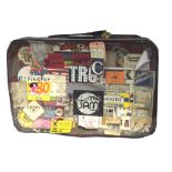 RICK BUCKLER; his iconic 1970s suitcase covered in all touring stage passes,