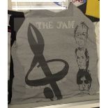 An original T-Shirt, Dig The New Breed, with treble clef beside images of Rick, Bruce & Paul.