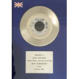 BPI Award; silver disk for Beat Surrender presented to record company executive John Orchard.
