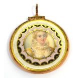 A late 19th century yellow metal framed circular locket,