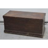 A large rectangular wooden chest of simple form with twin iron handles, length 102cm.