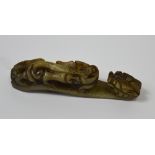 A carved jade belt hook, length 10cm.