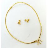 An 18ct gold collar necklace suspending three small diamonds and an 18ct gold pair of matching stud