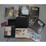 A large quantity of coins, some commemorative, some loose, mainly in binders,