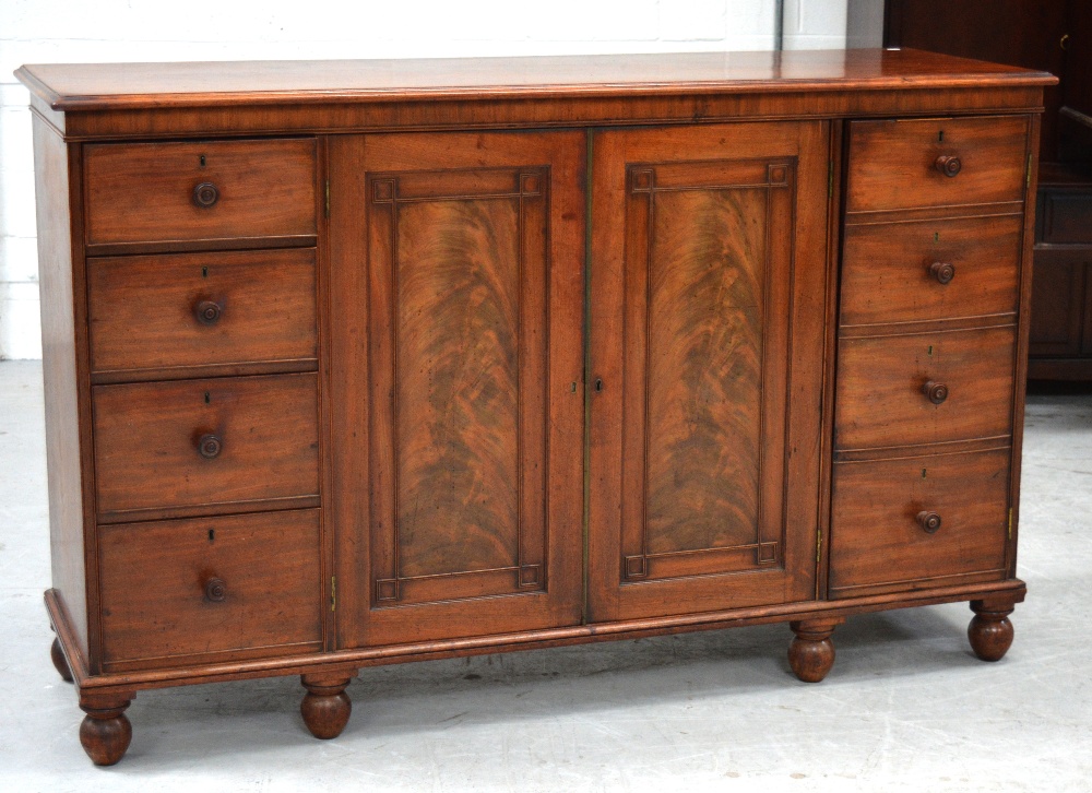 An early 19th century mahogany linen press,