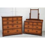 A large two-over-three pine chest of drawers with brass handles,