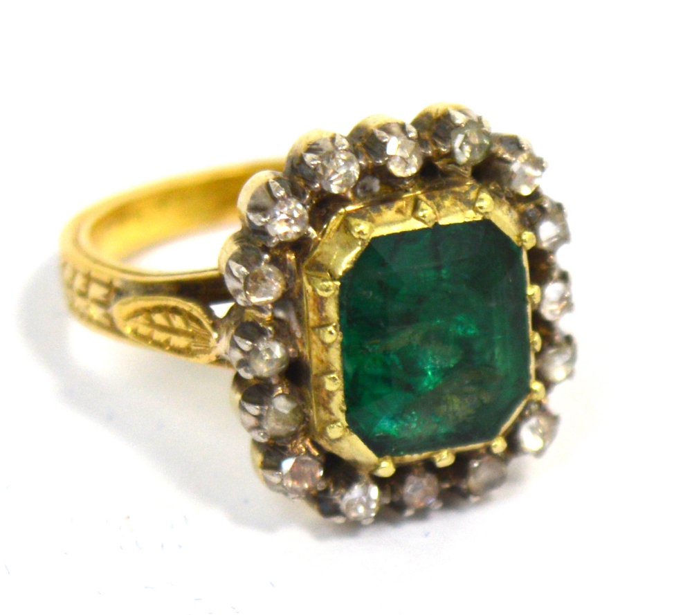 A yellow metal green tanzanite and diamond ring, indistinctly marked to back of shank, size M,
