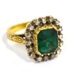 A yellow metal green tanzanite and diamond ring, indistinctly marked to back of shank, size M,