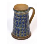 A Doulton Lambeth stoneware jug, decorated with repeating geometric design, approx height 16.5cm.