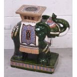 A modern decorative green ground ceramic elephant, height approx 60cm.