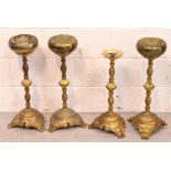 Four gilt metal and onyx smoker's stands each raised on three outstretched supports,