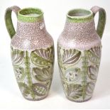 Glyn Colledge for Denby; a pair of ewers, each with scrolling handle,