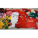 A quantity of Liverpool FC vintage clothing to include a signed FA Cup Final 1974 shirt,