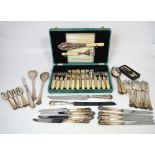 A large quantity of plated flatware to include knives, forks, spoons, dessert spoons,