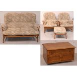 A retro Ercol bar back two-seater sofa, width approx 140cm, a pair of matching armchairs,