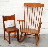 An Ercol style stick back rocking chair and a further child's chair (2).