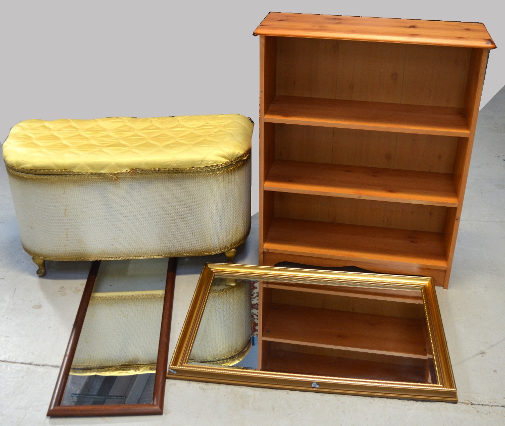 A simple three shelf pine bookcase, width 74cm, a Lloyd Loom style linen basket,