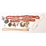 A quantity of costume jewellery to include three silver brooches,
