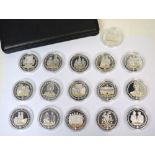 A cased set of sixteen diamond wedding anniversary silver proof coins,