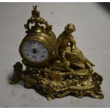 A decorative brass figural eight day mantel clock,