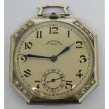 A platinum slim line crown wind octagonal diamond set pocket watch with sapphire winder the dial