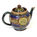 A Doulton Lambeth King Edward and Queen Alexandra 1902 coronation stoneware teapot, height 15cm.