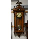 A Gustav Becker walnut cased eight day Vienna wall clock, the dial set with Roman numerals with 'G.