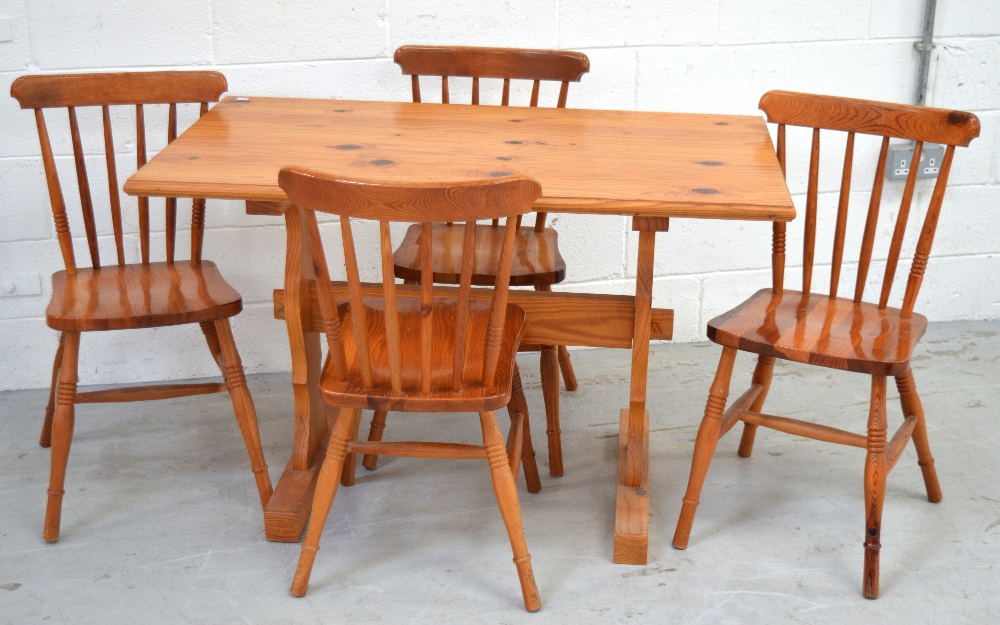 A pine refectory-style dining table, width 117cm and a set of four matching stick back chairs (5).