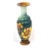 A Doulton Lambeth baluster vase, turquoise ground and decorated with flora, approx height 25.5cm.