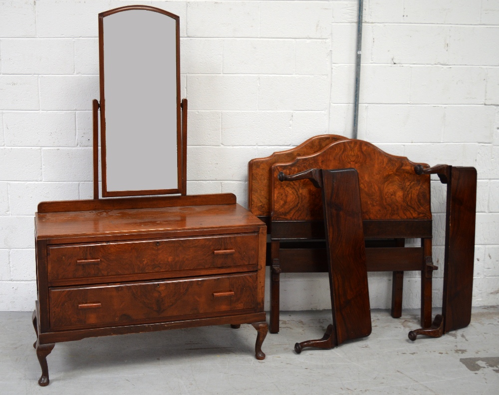 A walnut bedroom suite comprising two door wardrobe with lower long drawer on cabriole legs,