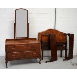 A walnut bedroom suite comprising two door wardrobe with lower long drawer on cabriole legs,