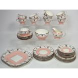A pink ground Aynsley tea service comprising cups, saucers, sugar bowl and milk jug,