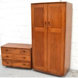 A retro Ercol Golden Dawn two door wardrobe width 91cm and a matching three drawer chest of drawers,