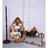 Two contemporary gilt framed wall mirrors, height of largest 104cm and a wooden standard lamp (3).