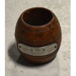 A small barrel shaped pot commemorating the 1937 coronation form the teak of HMS Snapdragon.