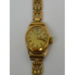 Rotary; a 9ct gold cased ladies' dress watch on a 9ct articulated bracelet.