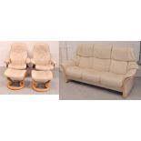 A Stressless style wooden frame cream suite comprising sofa, width 204cm,