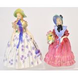 Two Royal Doulton figures 'Easter Day', approx height 19cm and 'Lady Betty', approx height 17cm (2).