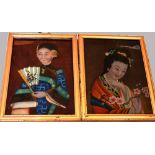 A pair of c1900 Oriental painted glass portraits, both 49 x 34cm, both framed and glazed (2).