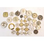 A quantity of wristwatch movements for use in watch restoration.