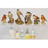 Four Royal Worcester bird figures and figure groups pied woodpeckers, a thrush,