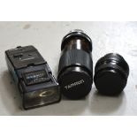 A cased Tamron Telamacro 1:3.8 camera lens, a Sigma 1:2.